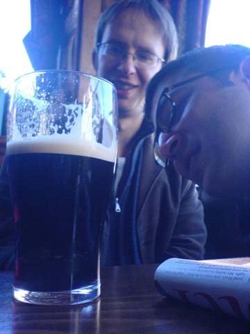 Neelesh and Luke peering at Guinness