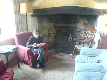 Warden Abbey main room, with fireplace (and Ann)